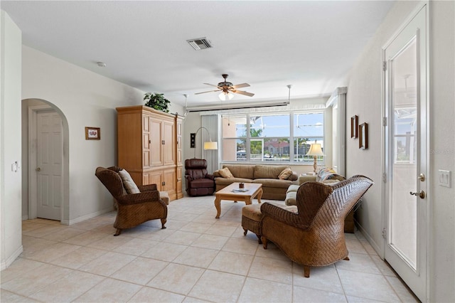 living room featuring ceiling fan and light tile patterned flooring