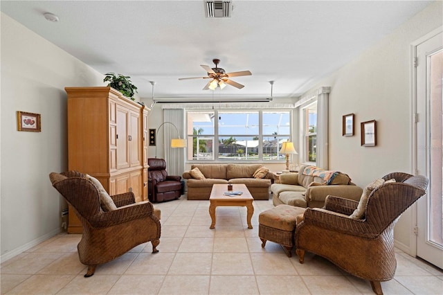 living room featuring light tile patterned flooring and ceiling fan