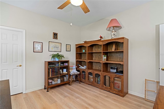 interior space featuring light hardwood / wood-style floors and ceiling fan