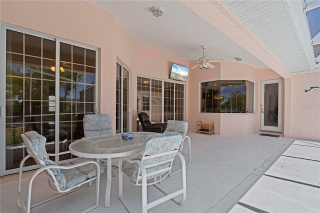 view of patio featuring ceiling fan