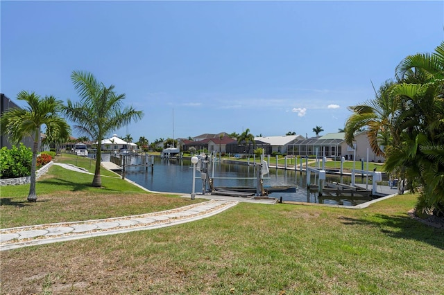 dock area featuring a yard and a water view