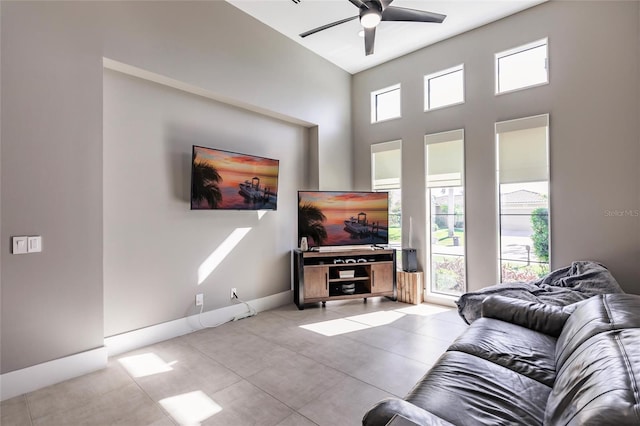 living room featuring light tile patterned floors and ceiling fan