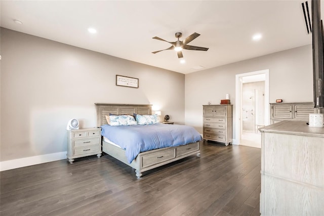 bedroom with connected bathroom, dark hardwood / wood-style floors, and ceiling fan