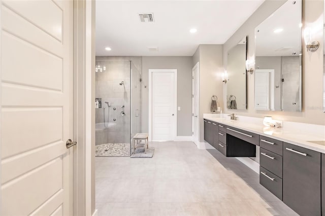 bathroom featuring vanity and a shower with door