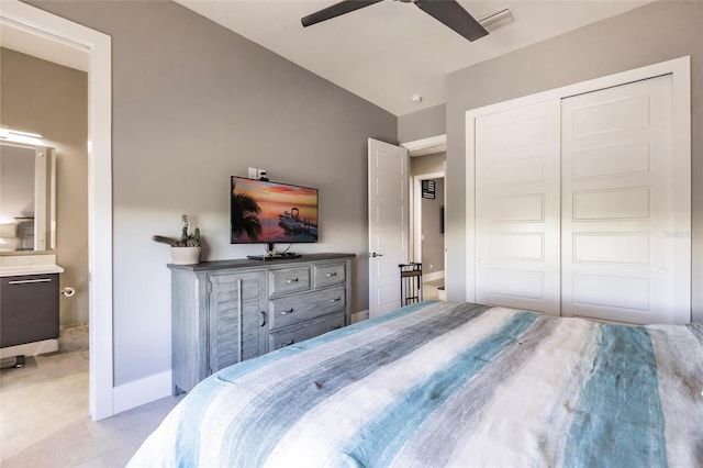 bedroom featuring ceiling fan, connected bathroom, and a closet