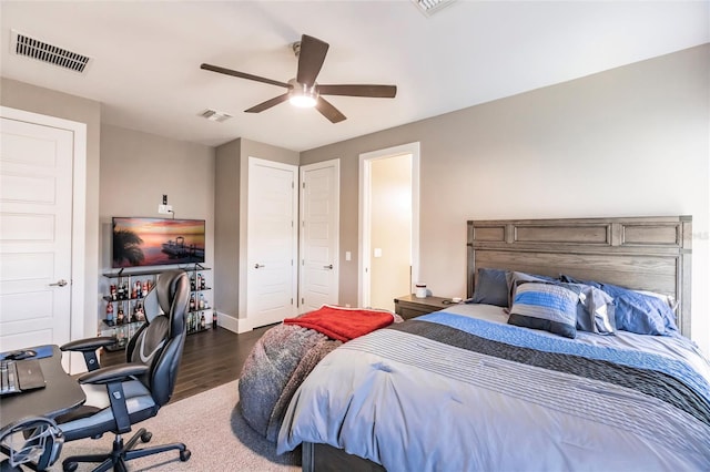 bedroom featuring dark hardwood / wood-style flooring and ceiling fan