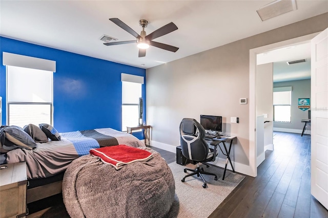 bedroom with ceiling fan and dark hardwood / wood-style flooring