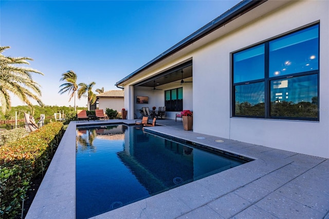 view of swimming pool with a patio area