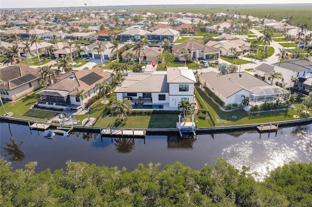 bird's eye view with a water view