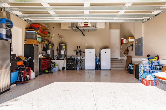 garage with electric panel, white fridge, and water heater