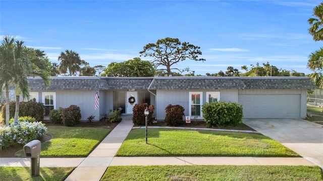 ranch-style house with a front yard and a garage