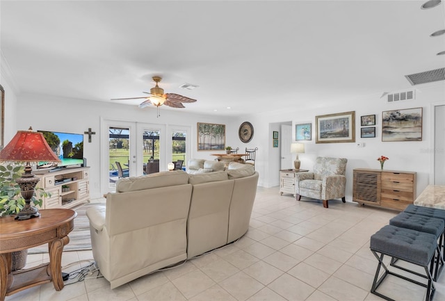 living room with ceiling fan and light tile patterned floors