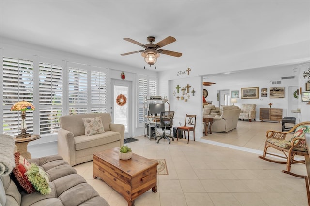 tiled living room with ceiling fan