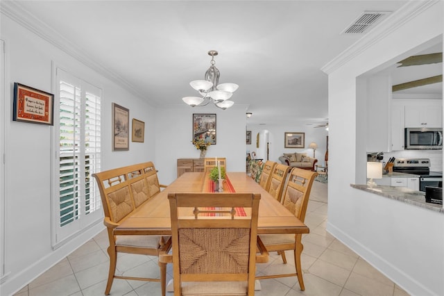 dining space featuring ceiling fan with notable chandelier, light tile patterned flooring, and ornamental molding