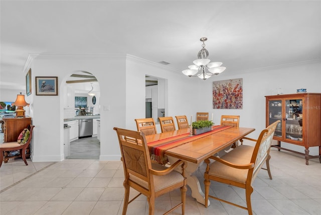 tiled dining room with crown molding and a notable chandelier