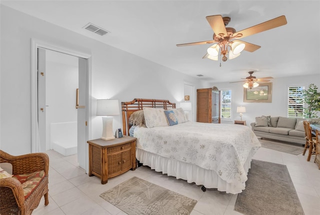 tiled bedroom with ceiling fan