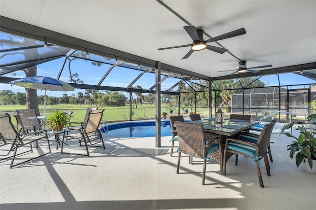 view of patio / terrace featuring glass enclosure