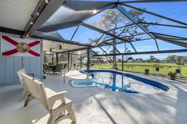 view of pool featuring a lanai and a patio