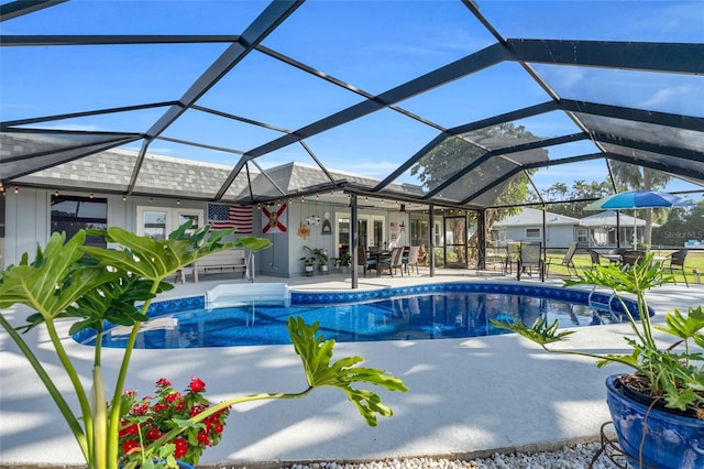 view of pool featuring glass enclosure, ceiling fan, a patio, and french doors