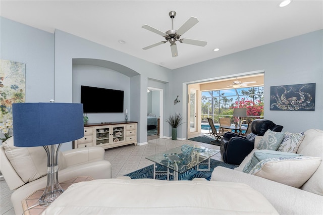 tiled living room with ceiling fan