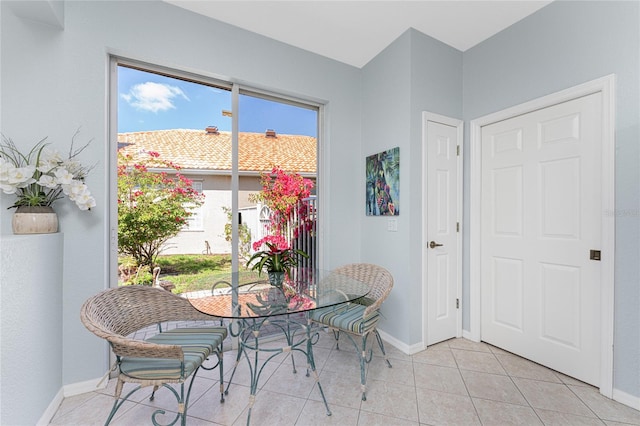 dining area with light tile patterned flooring