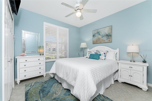 bedroom featuring ceiling fan and light tile patterned flooring