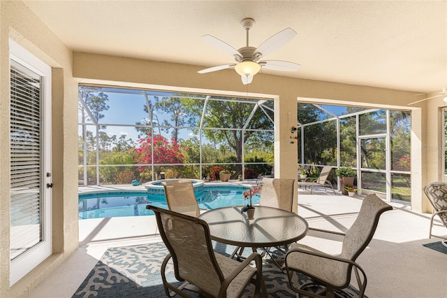 sunroom featuring plenty of natural light, ceiling fan, and a pool