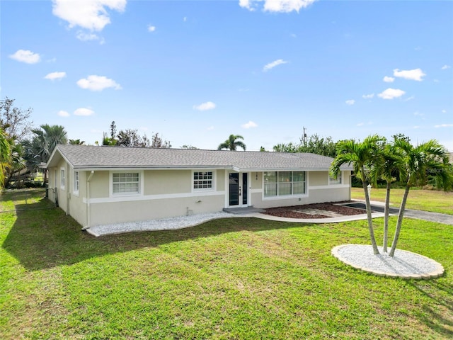 ranch-style home featuring a front lawn