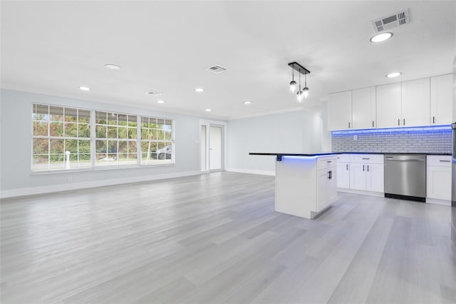 kitchen with stainless steel dishwasher, hanging light fixtures, white cabinets, and light wood-type flooring