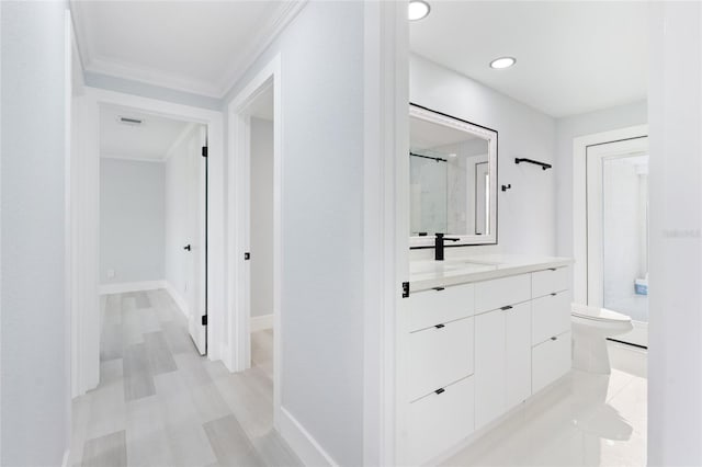 hall featuring sink and crown molding