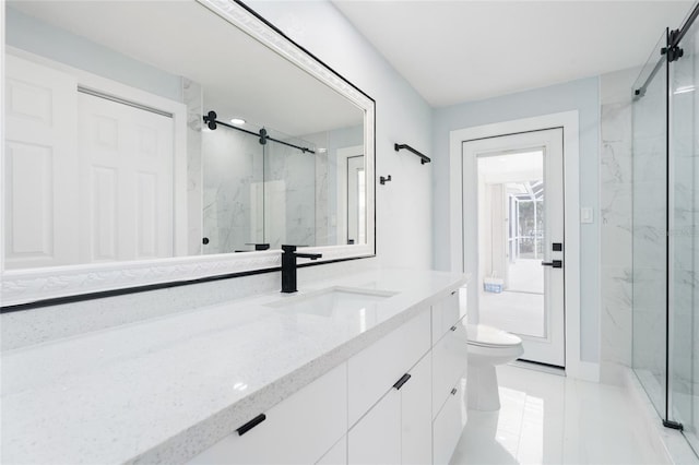 bathroom with an enclosed shower, vanity, and toilet