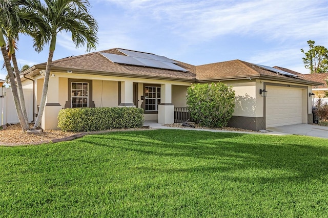 ranch-style house featuring solar panels, a garage, covered porch, and a front lawn