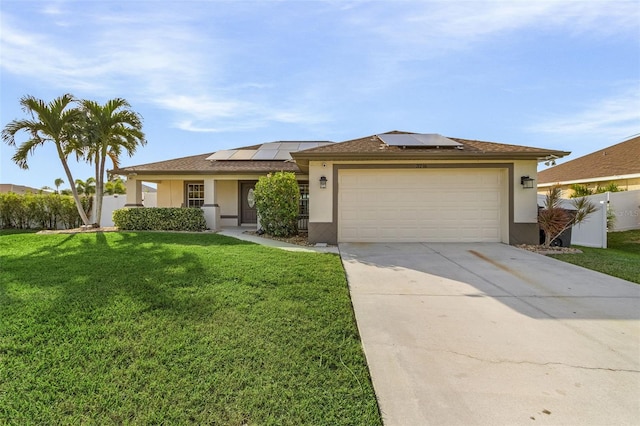 view of front of property with solar panels, a garage, and a front lawn