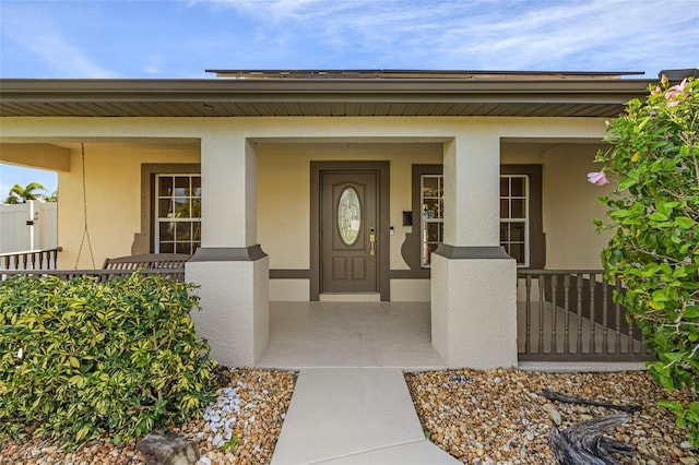 entrance to property with a porch