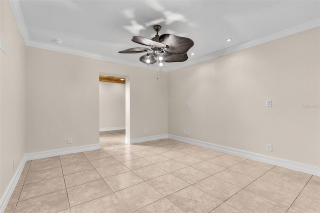 unfurnished room featuring ceiling fan, ornamental molding, and light tile patterned floors