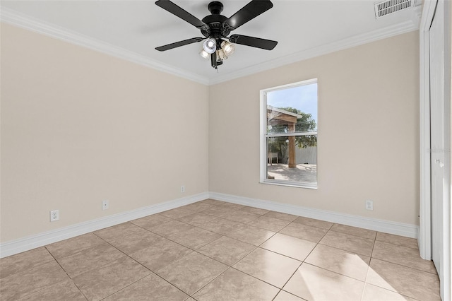 empty room with crown molding, ceiling fan, and light tile patterned floors