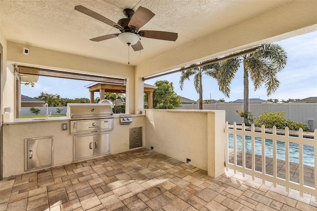 view of patio / terrace with a fenced in pool, a grill, and ceiling fan