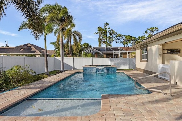 view of pool featuring an in ground hot tub