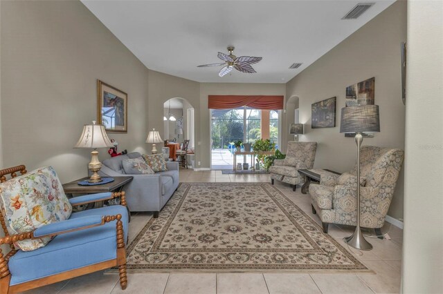 2388 Silver Palm Rd, North Port, FL 34288 - living area with tile patterned flooring, arched walkways, and ceiling fan