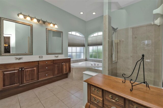 2388 Silver Palm Rd, North Port, FL 34288 - full bath with double vanity, a garden tub, tiled shower, tile patterned flooring, and recessed lighting