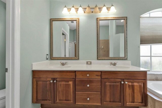 2388 Silver Palm Rd, North Port, FL 34288 - bathroom with double vanity and a garden tub