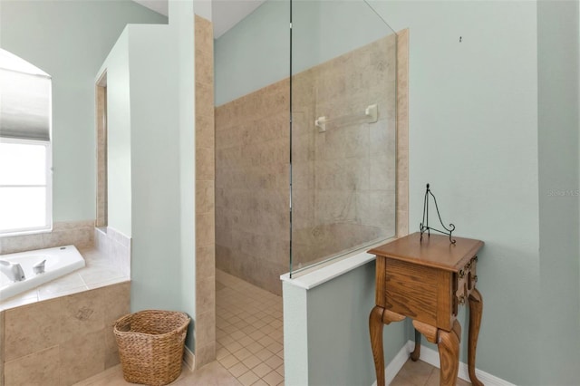 bathroom featuring tile patterned floors and separate shower and tub