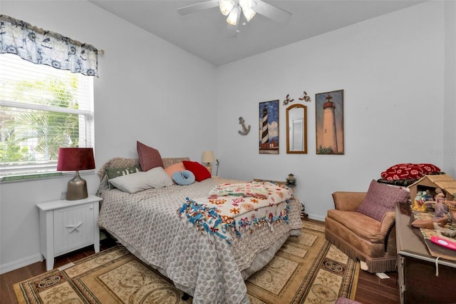 bedroom with ceiling fan and dark wood-type flooring