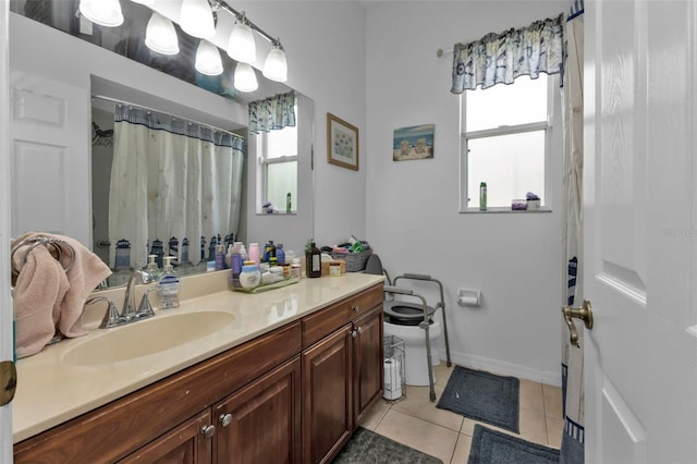 bathroom featuring vanity, tile patterned floors, a wealth of natural light, and curtained shower