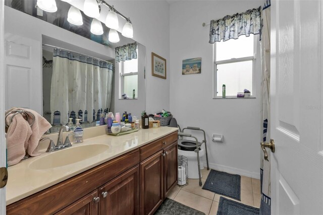 2388 Silver Palm Rd, North Port, FL 34288 - bathroom featuring vanity, tile patterned floors, and healthy amount of natural light