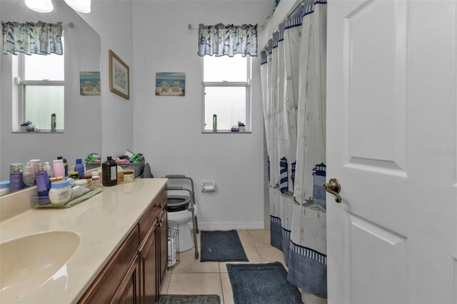 2388 Silver Palm Rd, North Port, FL 34288 - full bathroom featuring plenty of natural light, vanity, and tile patterned floors