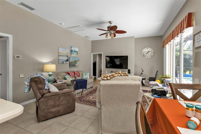 living room featuring ceiling fan and light tile patterned floors