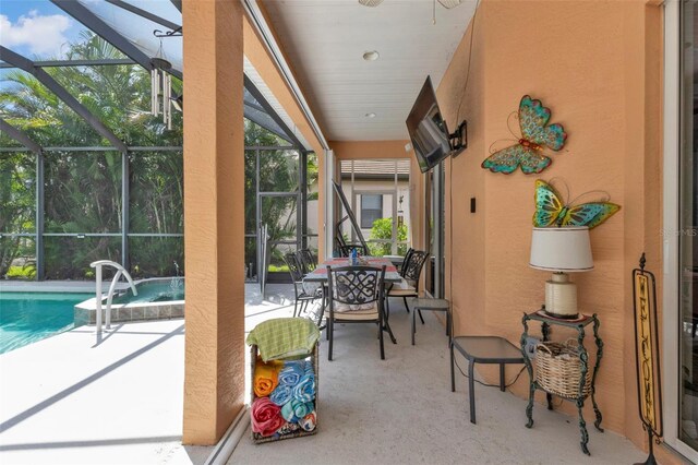 view of patio with a lanai