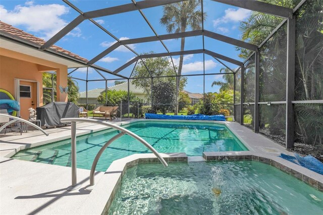 2388 Silver Palm Rd, North Port, FL 34288 - view of swimming pool featuring a pool with connected hot tub and a patio area
