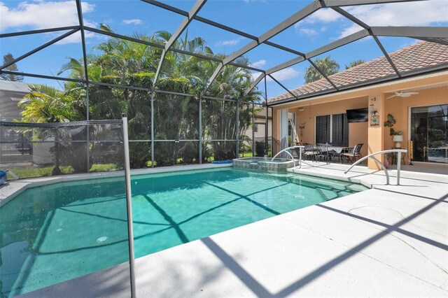 2388 Silver Palm Rd, North Port, FL 34288 - view of pool featuring a patio area, ceiling fan, a pool with connected hot tub, and a lanai